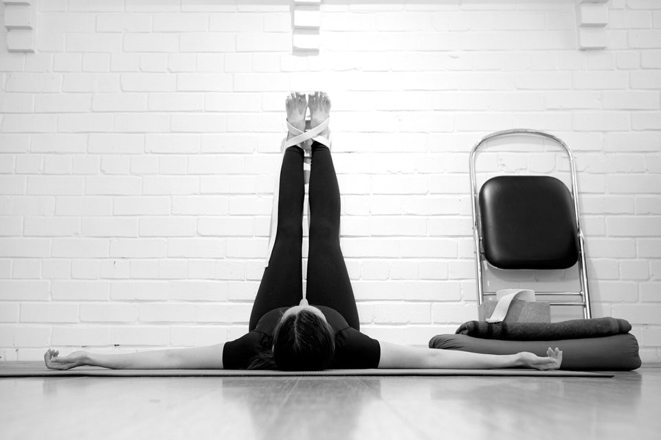 legs up wall in restorative yoga class